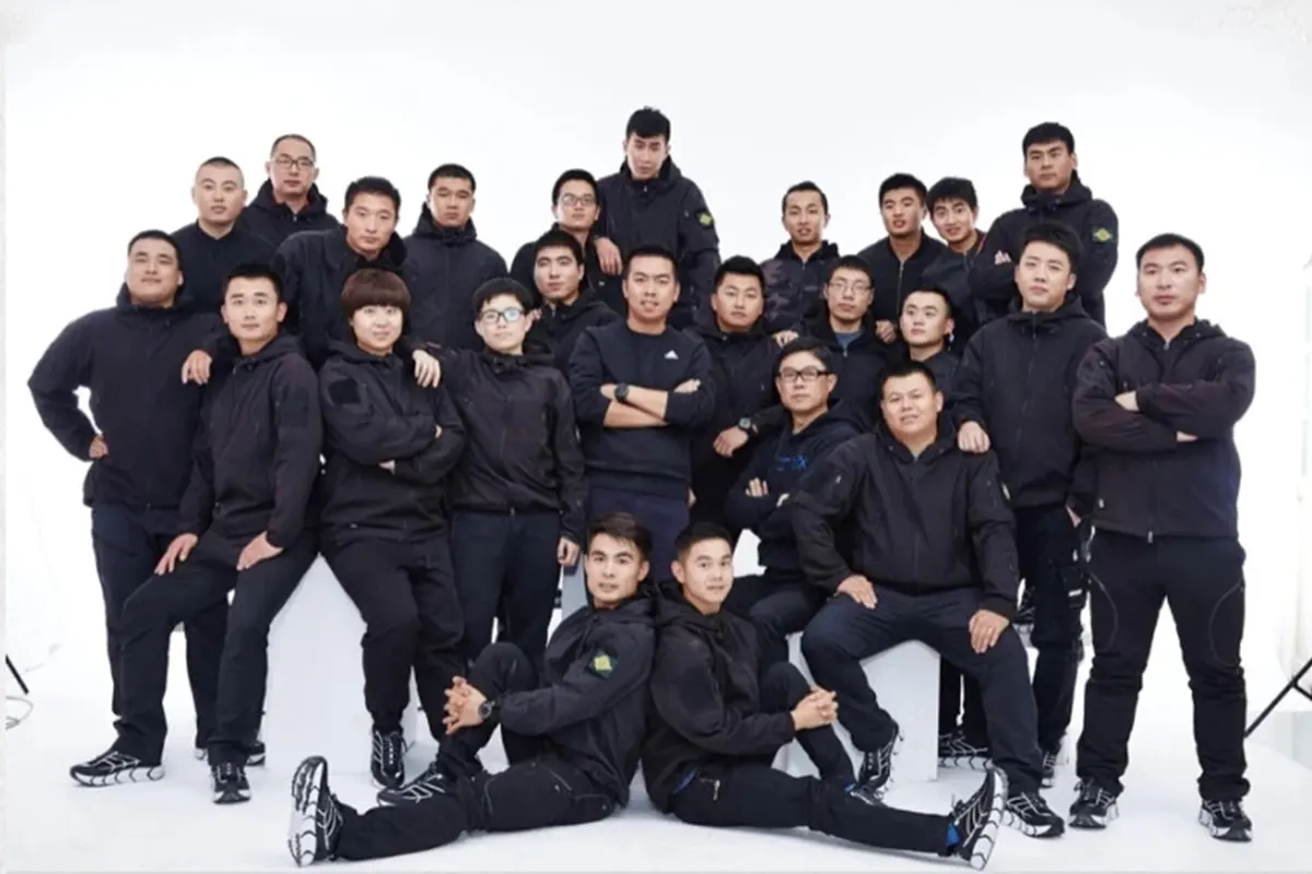 SublimApparel team photo — production floor and account staff, Yiwu factory
